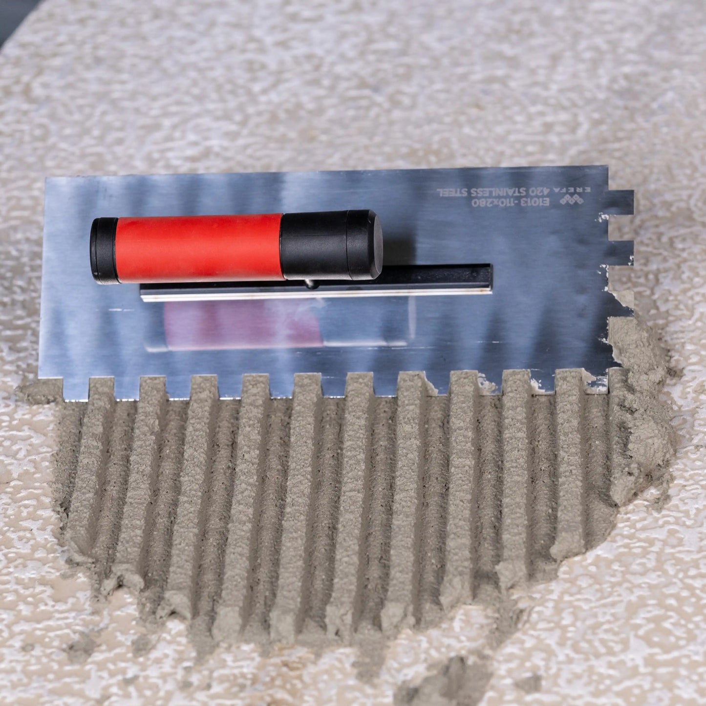 E1012 Inox gletarica sa zubima 10mm (110x280mm)